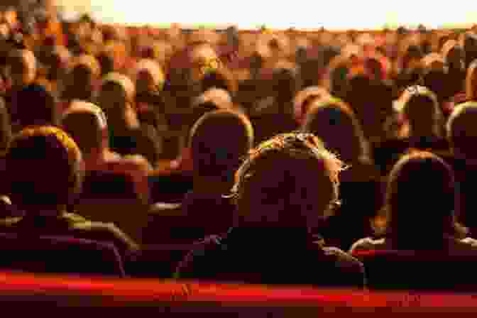 A Crowded Cinema Audience Attentively Watching A Movie On A Large Screen, Enveloped In A Communal Cinematic Experience. The Way Of The Projectionist: Alchemy S Secret Formula To Altered States And Breaking The Prison Of The Flesh